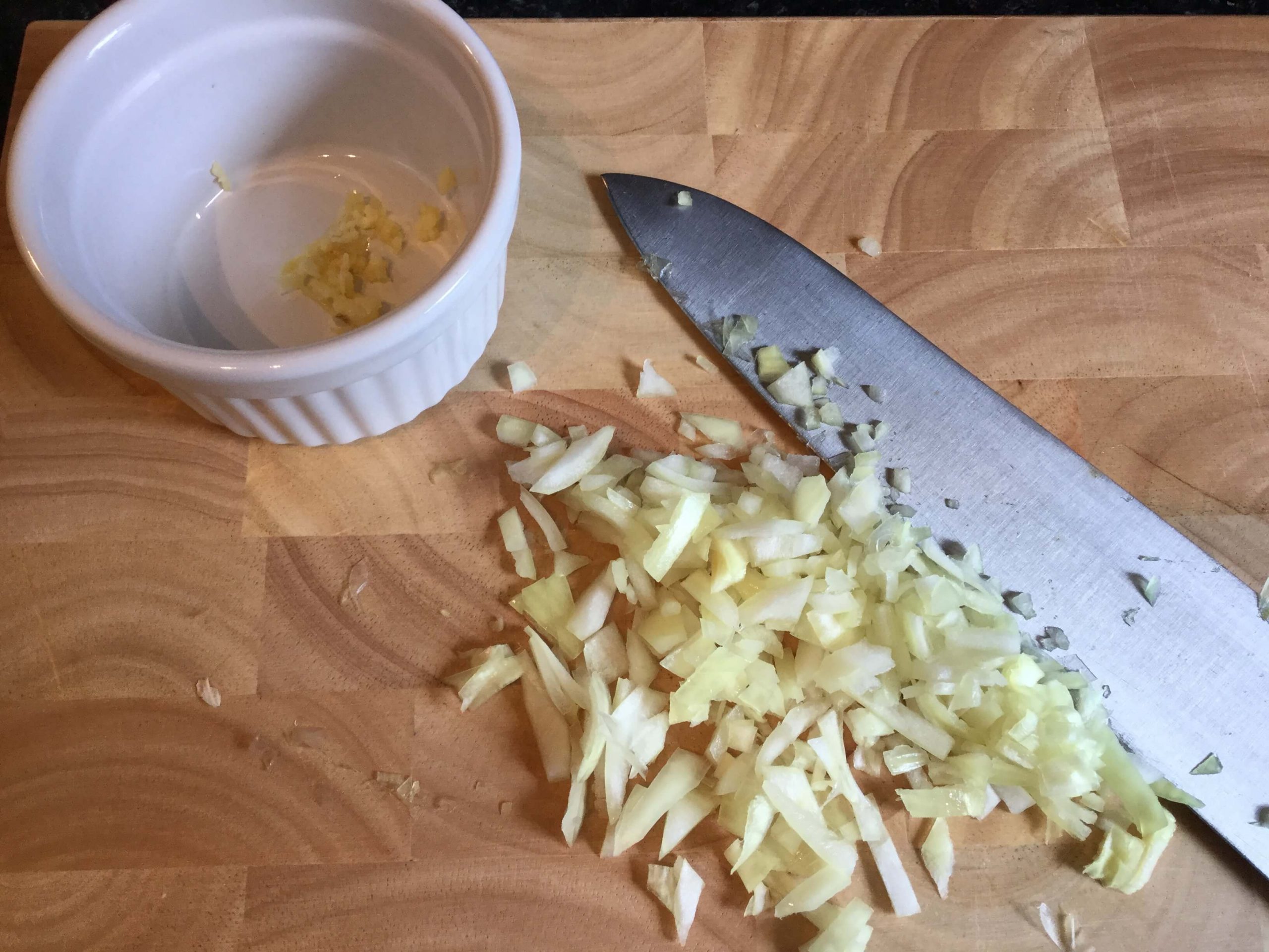 Start spaghetti cooking and prepare onion